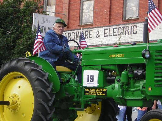 man on tractor in parade